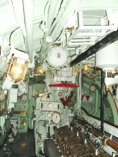 Submarine U3. The diesel motor meters in the center. The big red wheel controls the hull valve for the exhaust pipe.